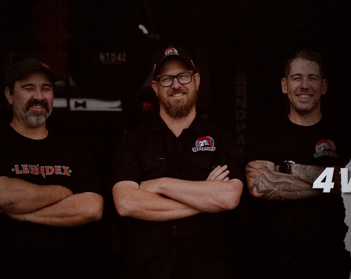 Three of the Legendex crew in workshop shirts in the Narangba workshop
